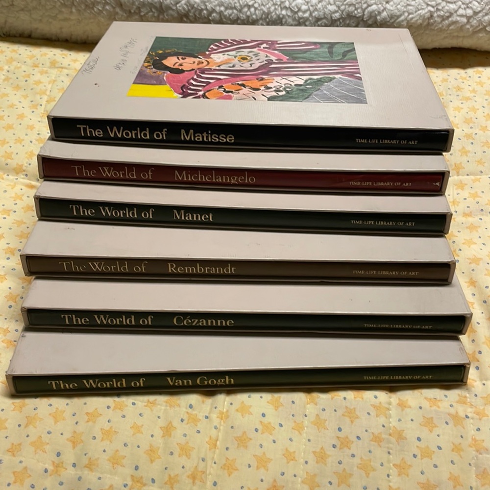 Books of famous artists with book sleeves